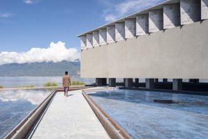 Islamic Centre Nurul Yaqin Mosque, in Palu, Central Sulawesi, by Dave Orlando and Fandy Gunawan, is erected on the site of a former mosque destroyed by a tsunami in 2018. The new Islamic Centre serves as a space for gathering and worship. Open to the landscape, it is surrounded by a shallow reflective pool which can be drained to accommodate more people.