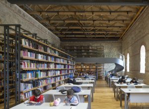 Rami Library, by Han Tümertekin Design & Consultancy, the largest library in Istanbul. It took up quarters in the former Rami Barracks, a large single-storey structure with high volumes, built in the 18th century. A minimal intervention approach was chosen to preserve the original spatial qualities of the structure while accommodating new library functions.